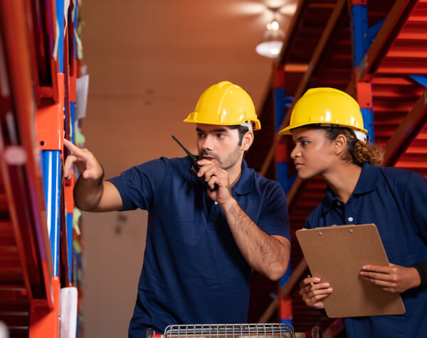 Warehouse Worker Organizing Inventory in a Logistics